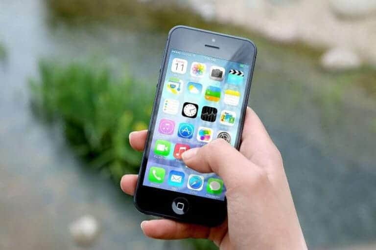 Person on an iPhone|Why you should use a contact form.
