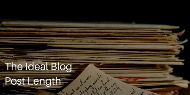 The Ideal Blog Post Length with stack of papers with writing on them in background.