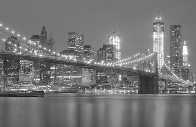 City at night with a bridge connecting it